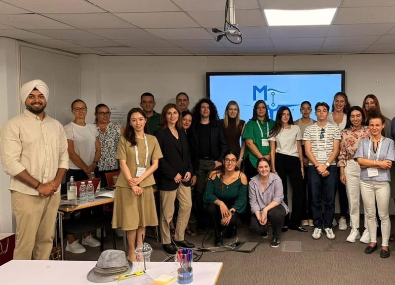 Group of MariTech Talent Programme participants posing in a classroom in Limassol in front of a screen